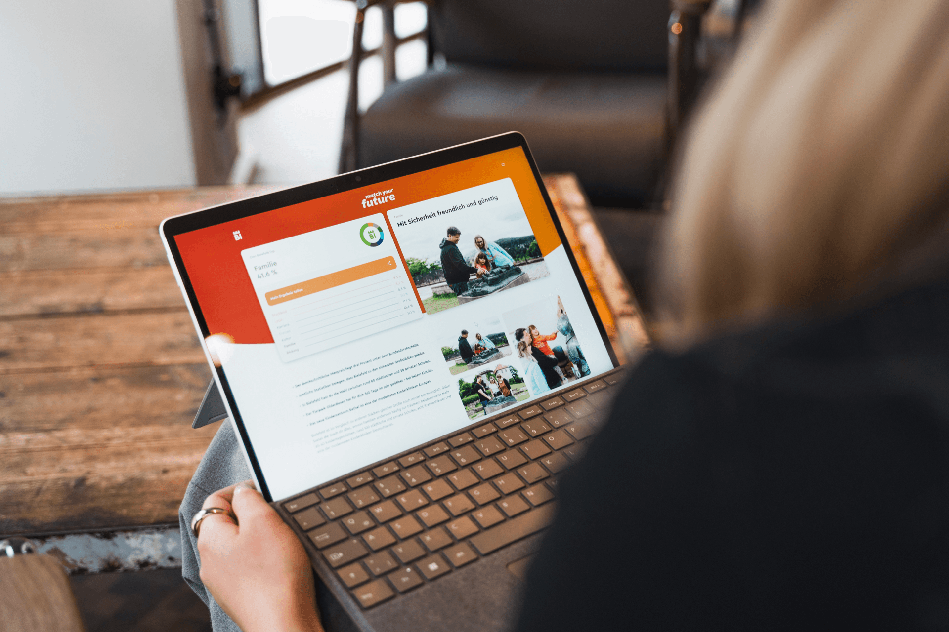 Woman holding a laptop in her hands
